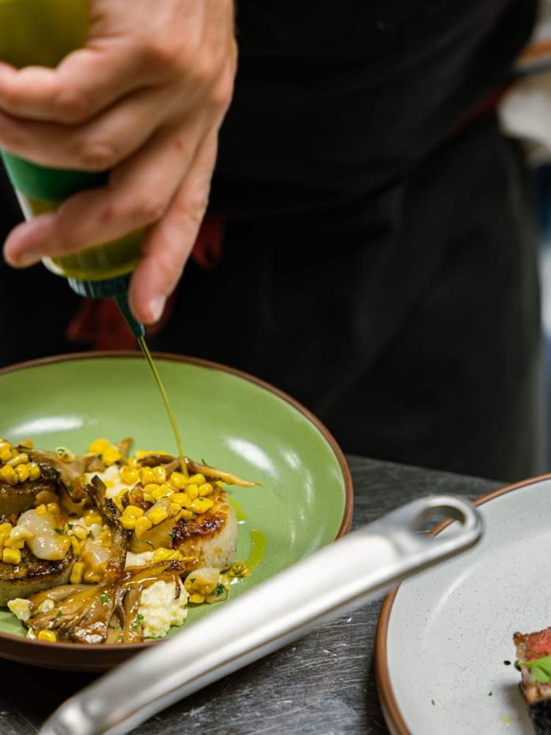 CHEF FINISHING A DISH